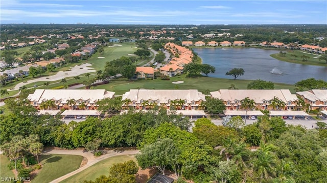 drone / aerial view featuring a residential view, a water view, and view of golf course