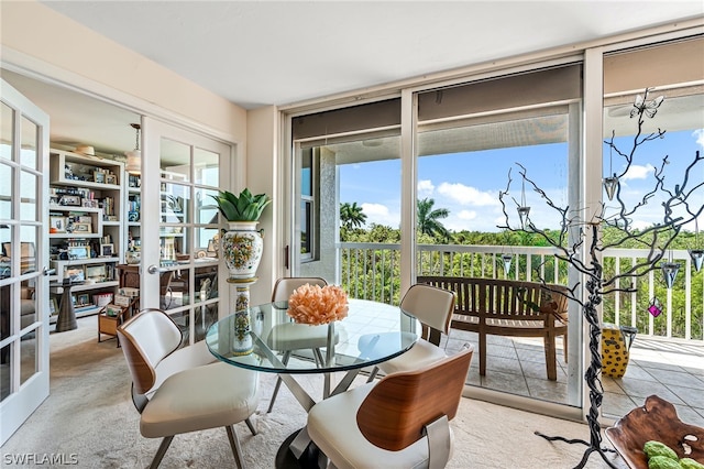 sunroom featuring french doors