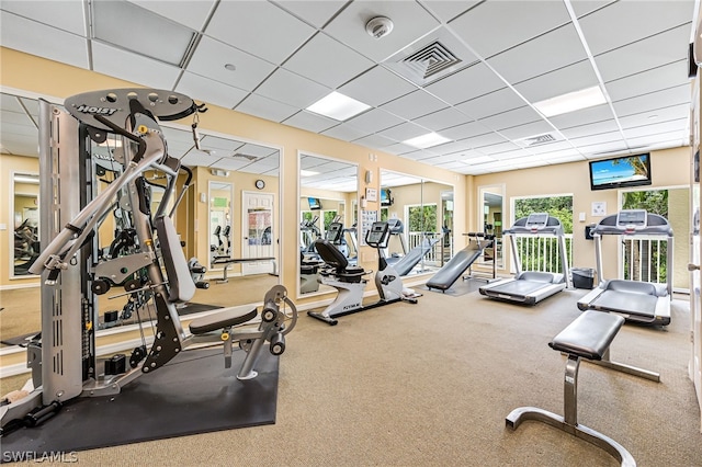 workout area featuring a paneled ceiling and visible vents