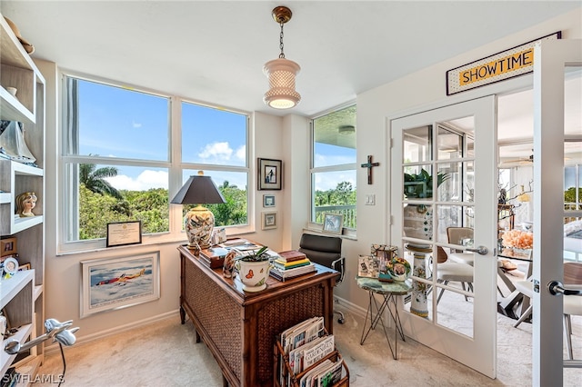 home office featuring light carpet, baseboards, and french doors