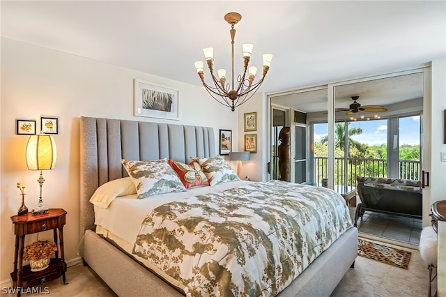 carpeted bedroom featuring a chandelier and access to outside