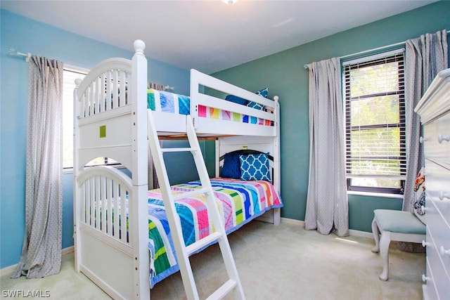 carpeted bedroom with baseboards