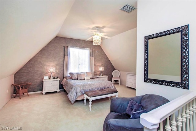 bedroom with vaulted ceiling, visible vents, and carpet floors