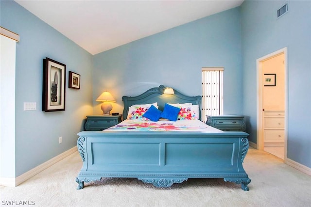 bedroom featuring lofted ceiling, baseboards, visible vents, and light carpet