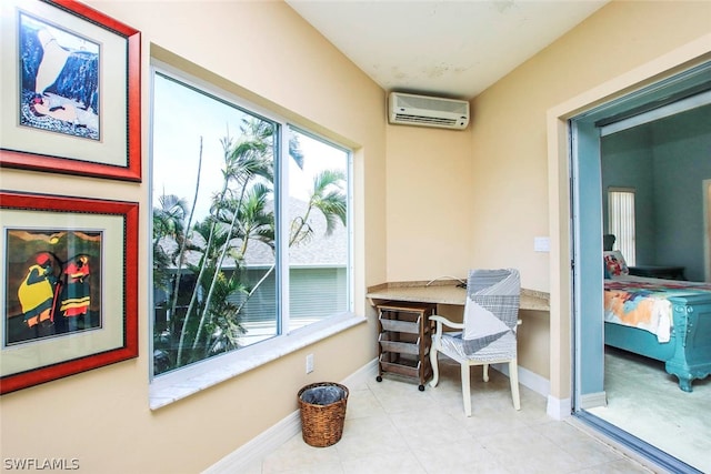 sunroom / solarium with a wall mounted air conditioner