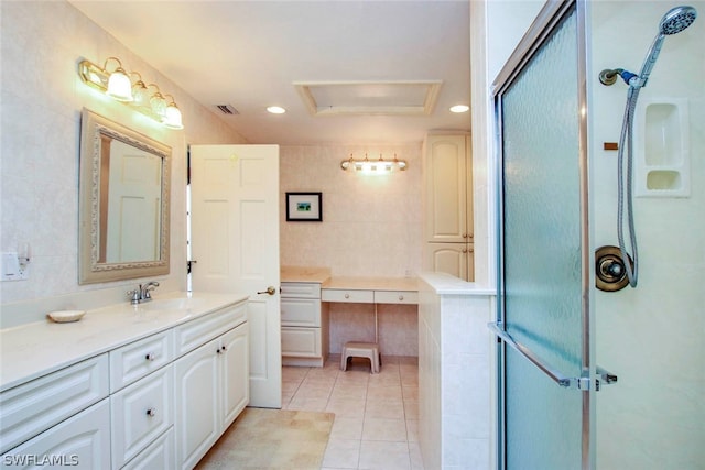 bathroom with tile patterned floors, visible vents, recessed lighting, a shower stall, and vanity