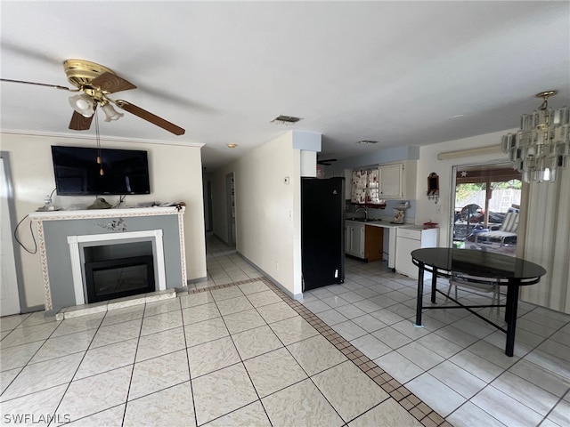 interior space featuring light tile floors, white cabinetry, ceiling fan, and black fridge