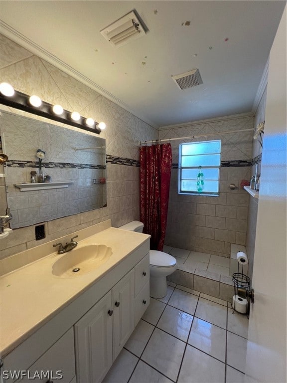 bathroom featuring tile walls, toilet, crown molding, tile floors, and oversized vanity