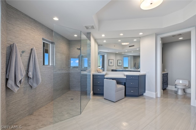 full bath with a walk in shower, toilet, vanity, and visible vents