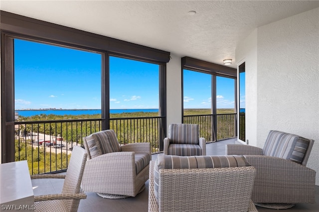 sunroom with a water view