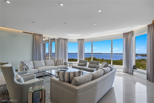 living room with a water view and plenty of natural light