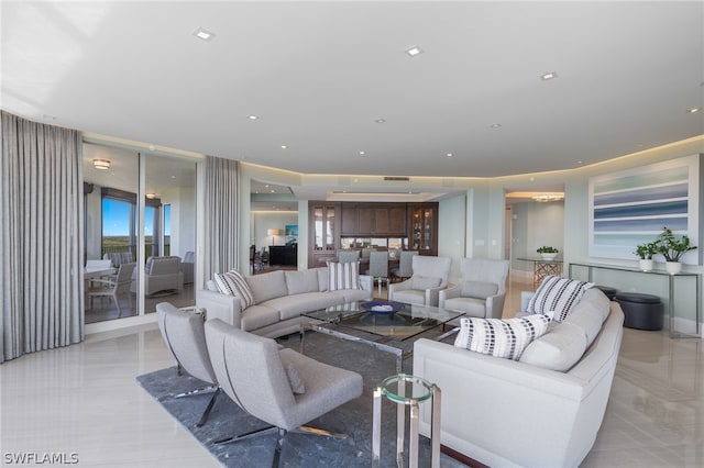 living area with visible vents and recessed lighting