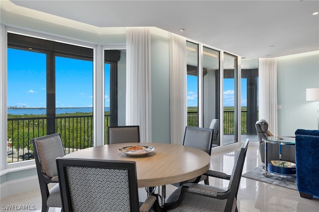 dining room featuring a water view