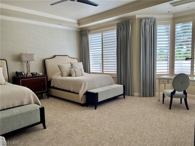 bedroom featuring multiple windows, light colored carpet, ornamental molding, and ceiling fan