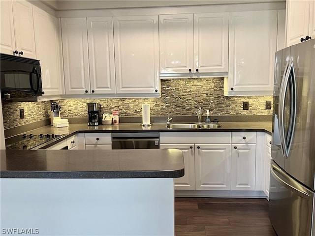 kitchen featuring white cabinetry, kitchen peninsula, sink, and black appliances