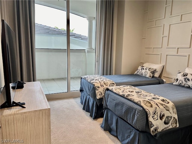 bedroom featuring light colored carpet