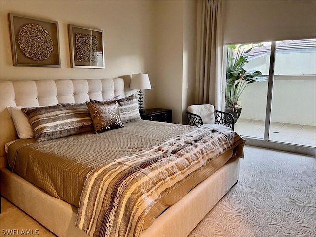 carpeted bedroom featuring access to exterior