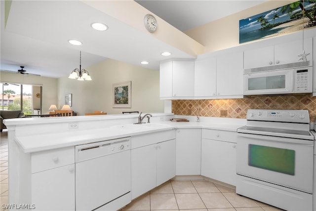 kitchen featuring white cabinets, white appliances, kitchen peninsula, and ceiling fan with notable chandelier