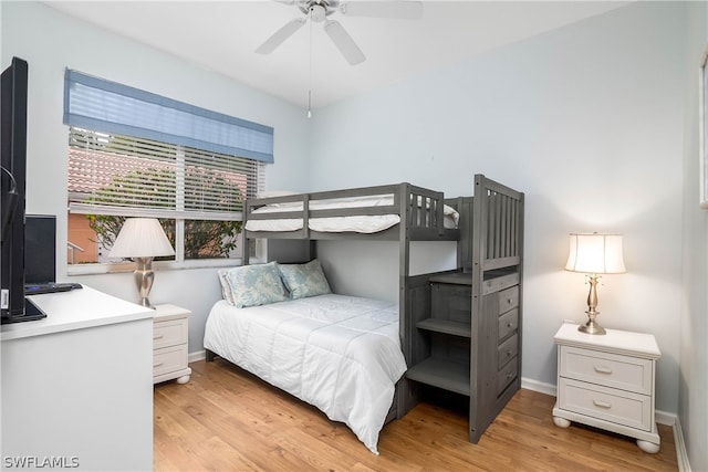 bedroom with light hardwood / wood-style floors and ceiling fan