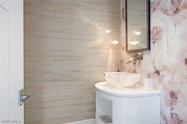 bathroom featuring tile walls and vanity