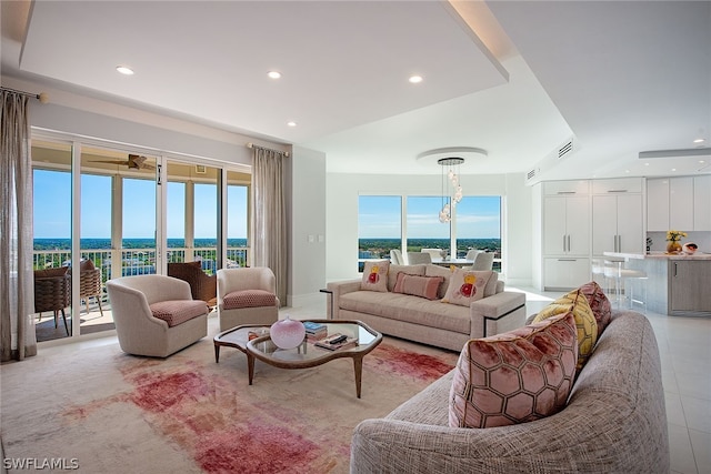 tiled living room with a raised ceiling