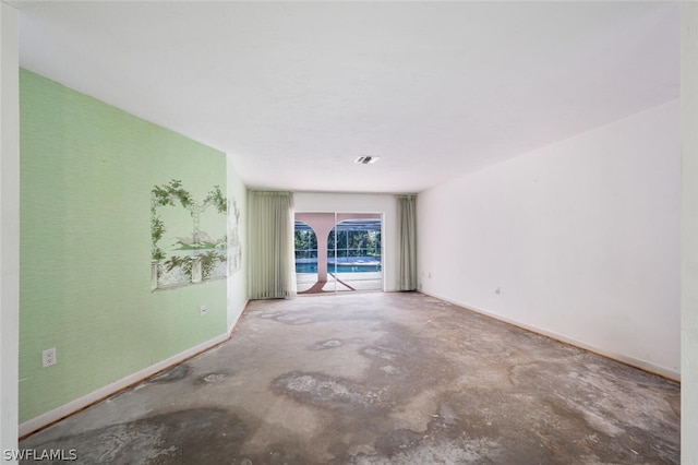 empty room featuring concrete flooring