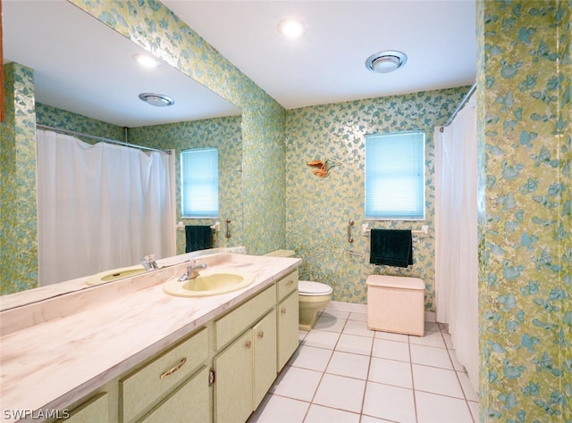 bathroom with tile floors, toilet, and oversized vanity