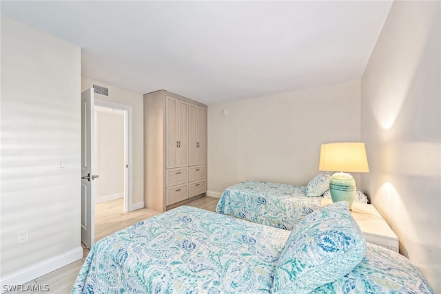 bedroom with light hardwood / wood-style flooring