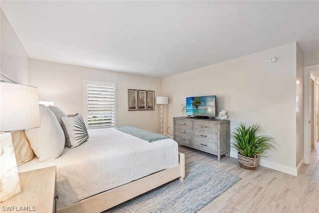 bedroom with light wood-type flooring