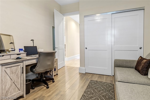 office space with light hardwood / wood-style flooring