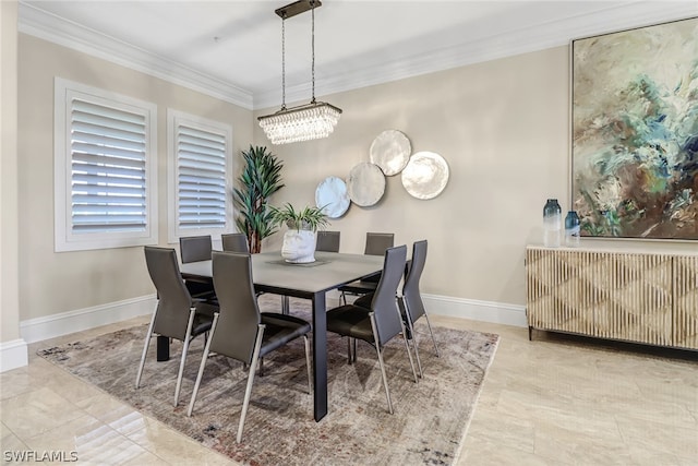 dining space featuring crown molding and a chandelier