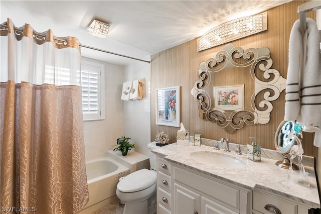 full bathroom featuring toilet, shower / bath combo, and vanity