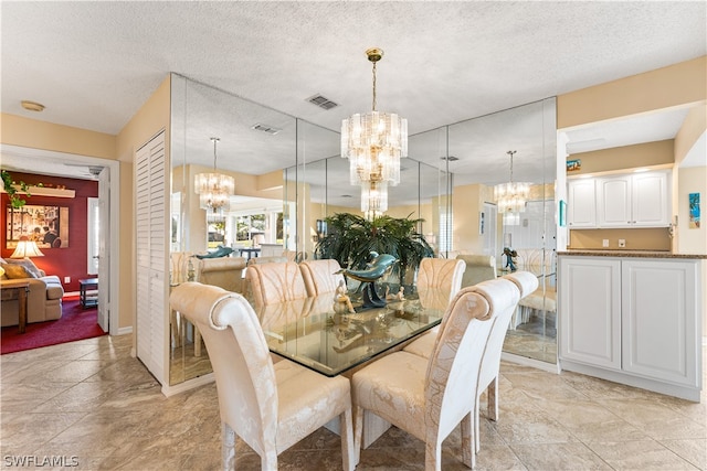 dining space with a textured ceiling