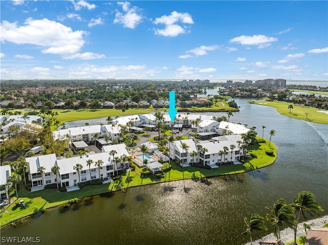 birds eye view of property with a water view