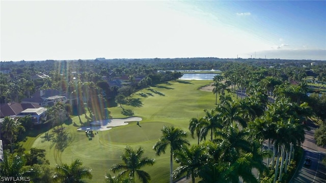 aerial view with a water view and view of golf course