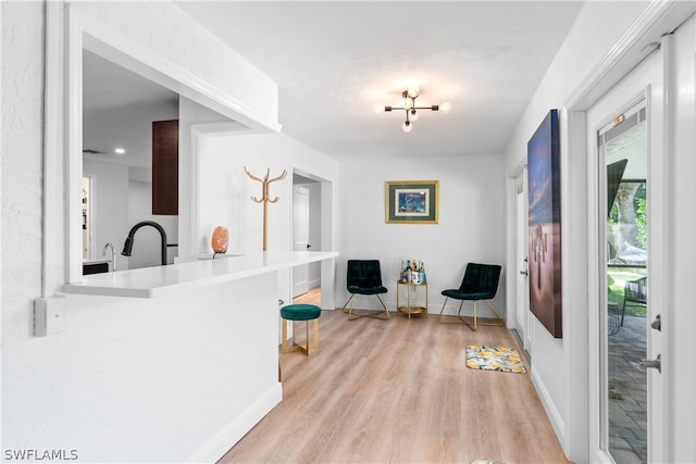 interior space with baseboards and light wood-style floors