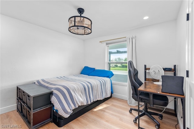 bedroom featuring recessed lighting, baseboards, and light wood finished floors