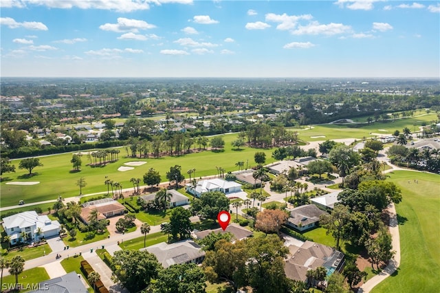 aerial view featuring view of golf course and a residential view