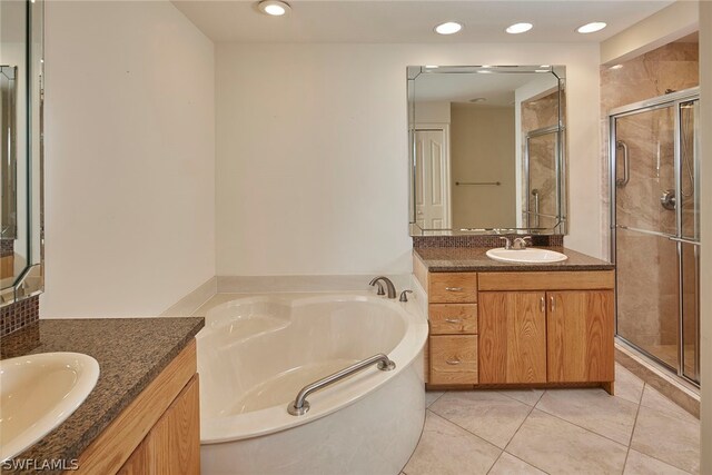 bathroom with vanity, plus walk in shower, and tile floors