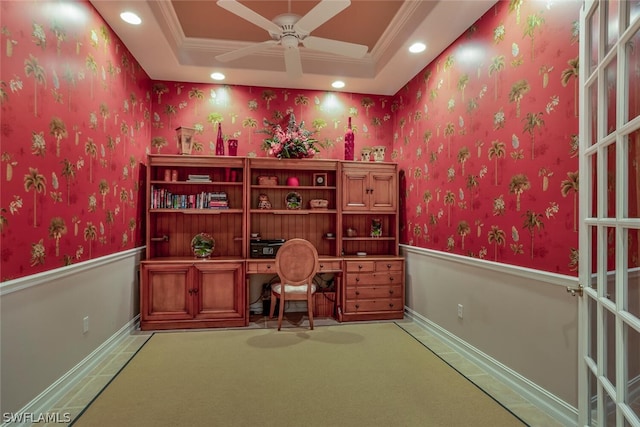 office with crown molding, carpet floors, ceiling fan, and a raised ceiling