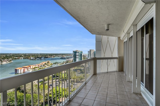 balcony featuring a water view