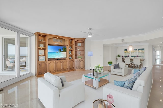 living room with crown molding, built in shelves, ceiling fan, and light tile floors