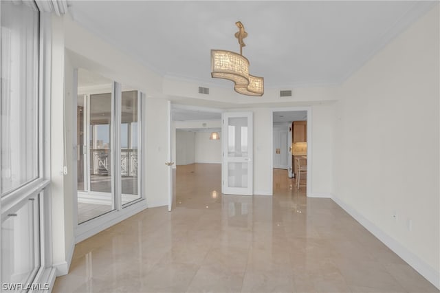 tiled spare room with crown molding