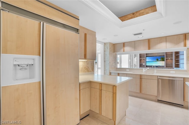 kitchen with paneled fridge, light brown cabinets, light tile floors, and stainless steel dishwasher