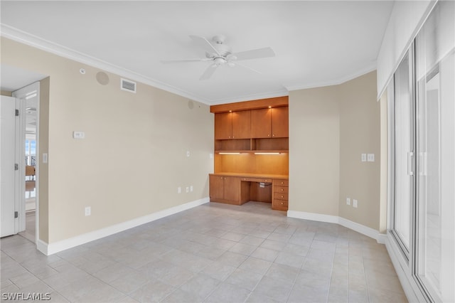 unfurnished bedroom with light tile floors, crown molding, ceiling fan, and built in desk