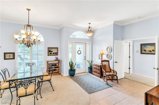 entrance foyer with light tile floors, crown molding, and an inviting chandelier