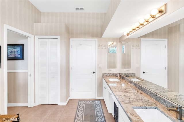 bathroom with double sink, tile flooring, and oversized vanity