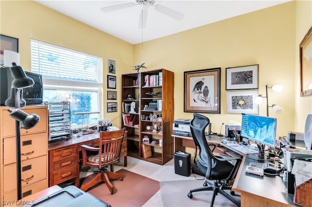 home office featuring light colored carpet and ceiling fan