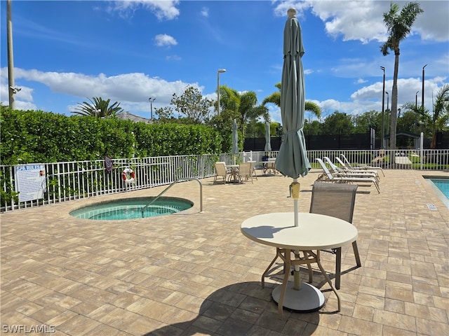 view of swimming pool with a patio area