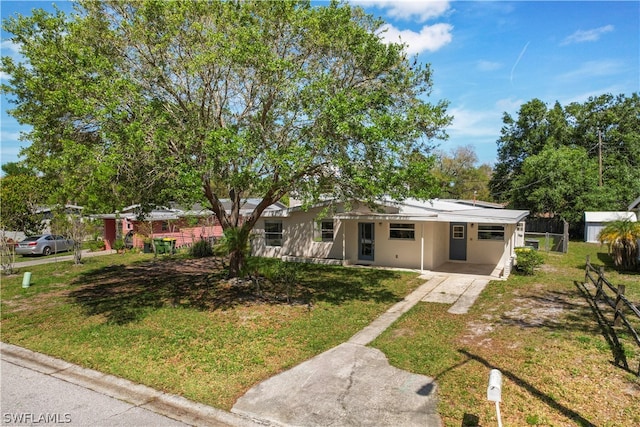 ranch-style home with a front lawn